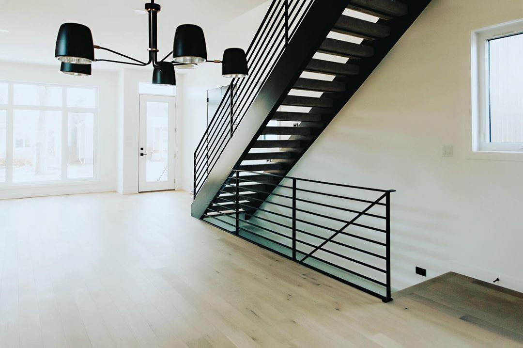 Loving the horizontal rails on this open rise staircase.  
#platinumlivinghomes …